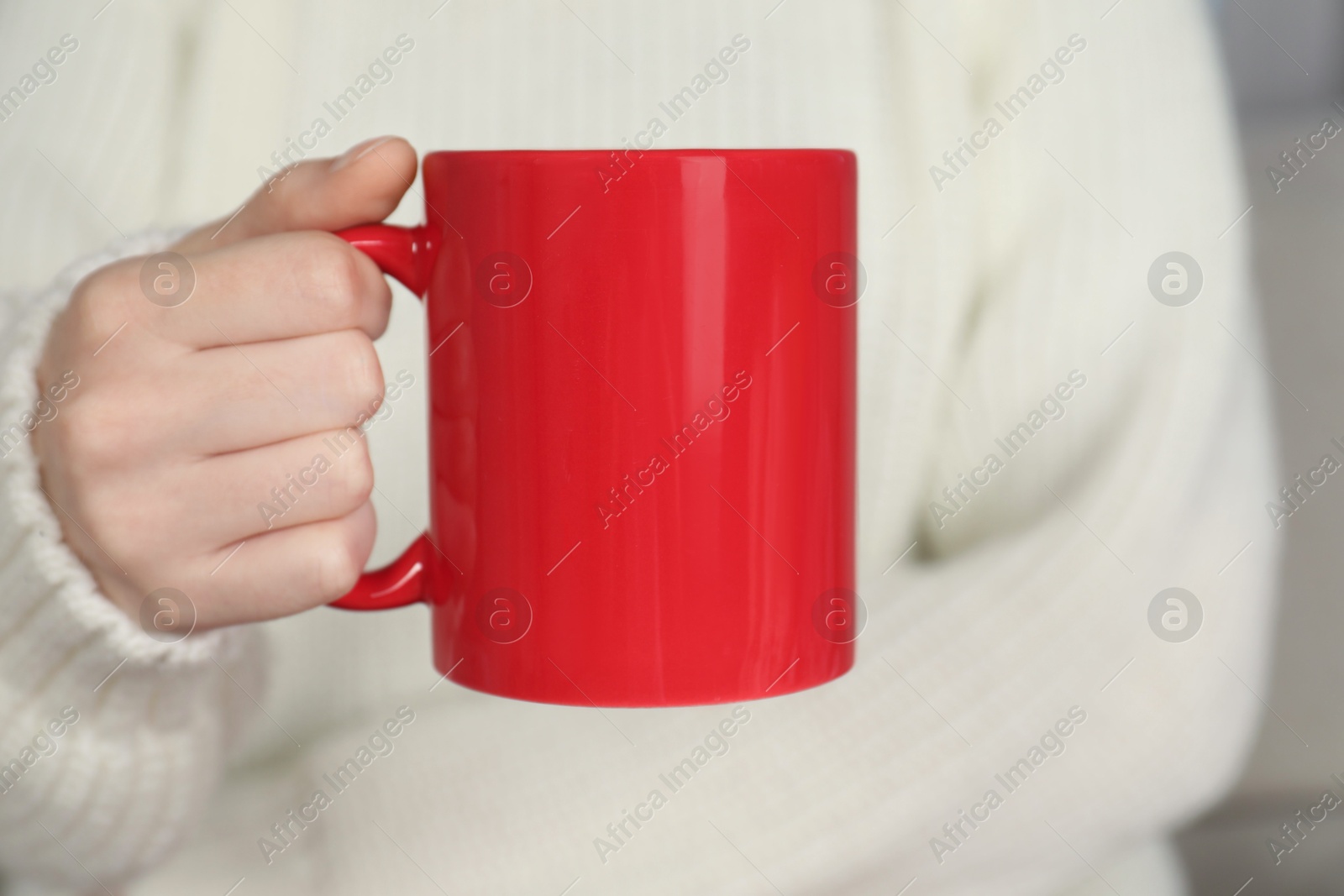 Photo of Woman with red ceramic cup, closeup. Mockup for design