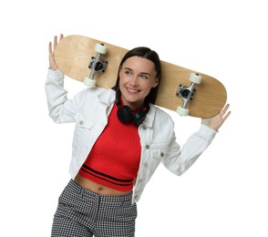 Smiling woman with skateboard on white background