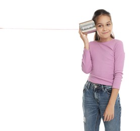 Photo of Girl using tin can telephone on white background