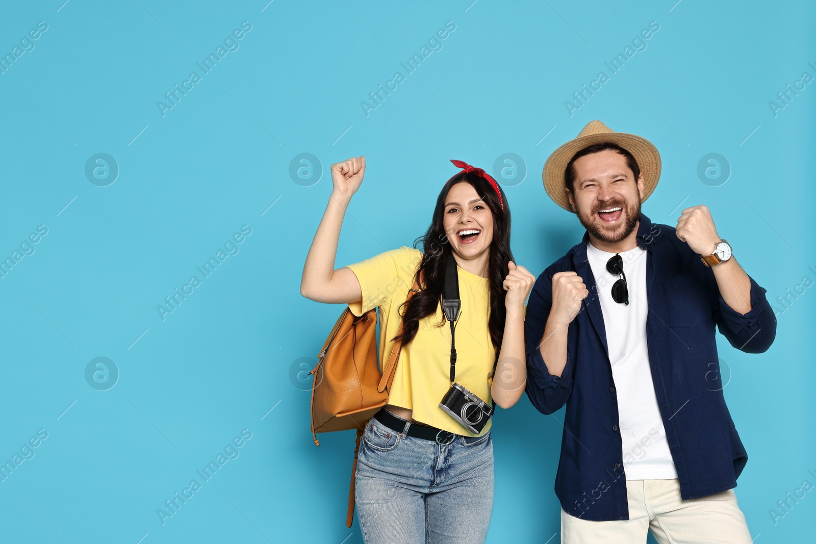 Photo of Tourism. Emotional couple on light blue background, space for text