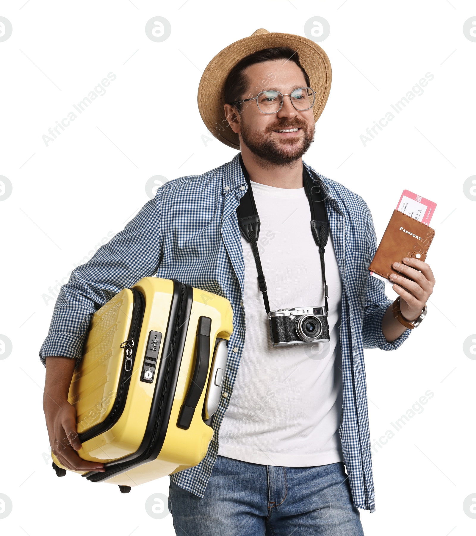 Photo of Happy tourist in hat with suitcase, passport and ticket on white background