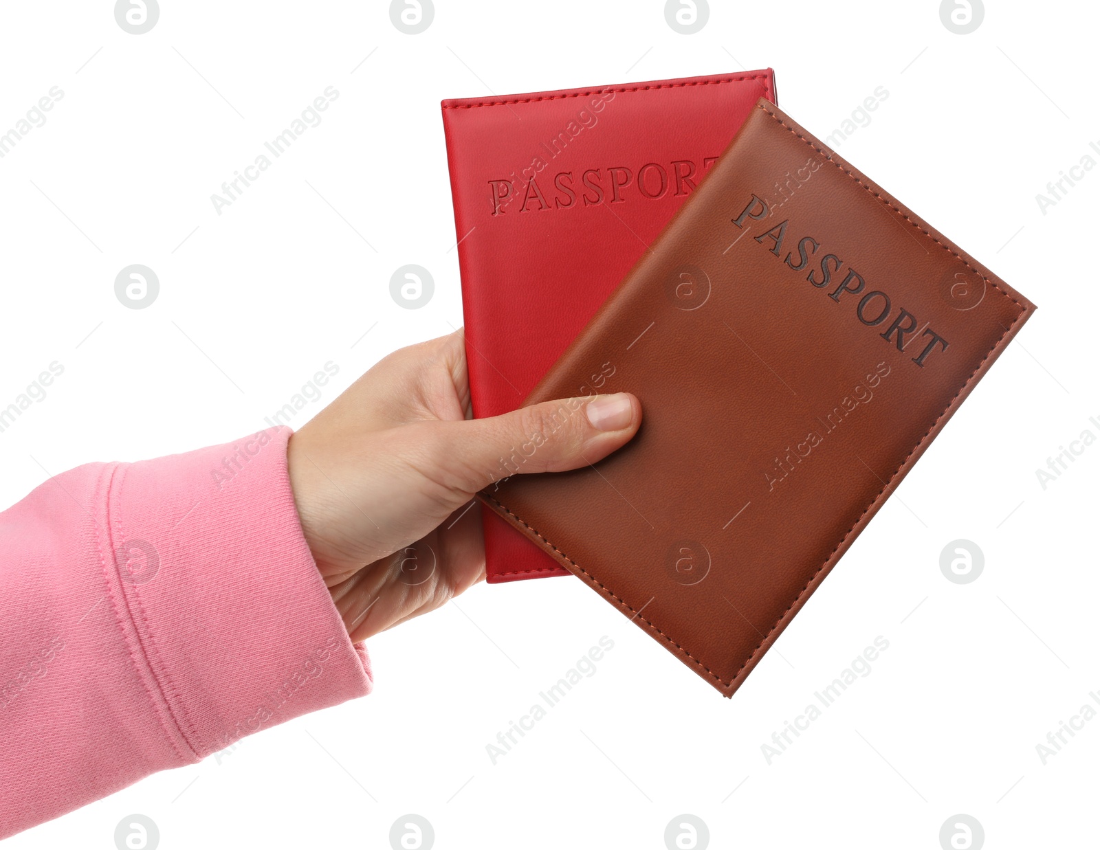 Photo of Woman holding passports in bright covers on white background, closeup