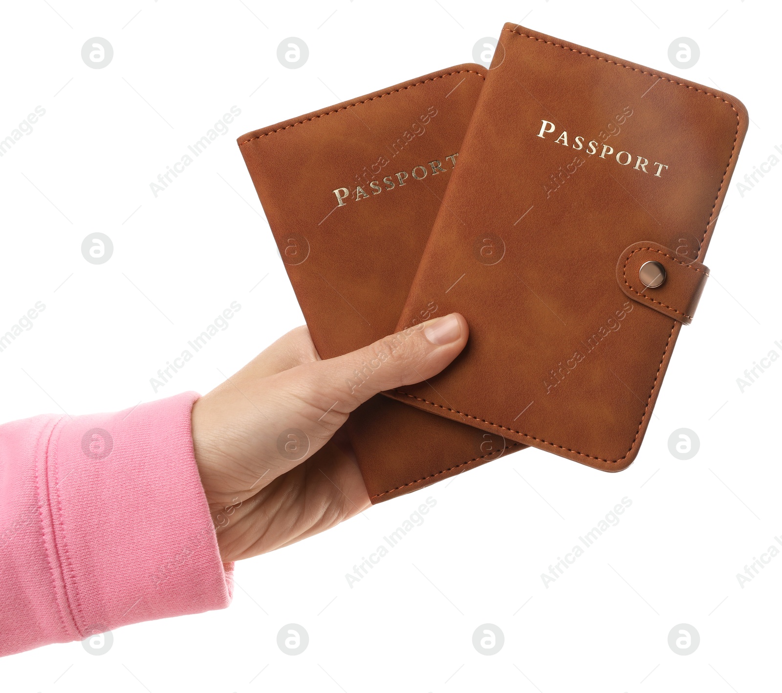 Photo of Woman holding passports in bright covers on white background, closeup