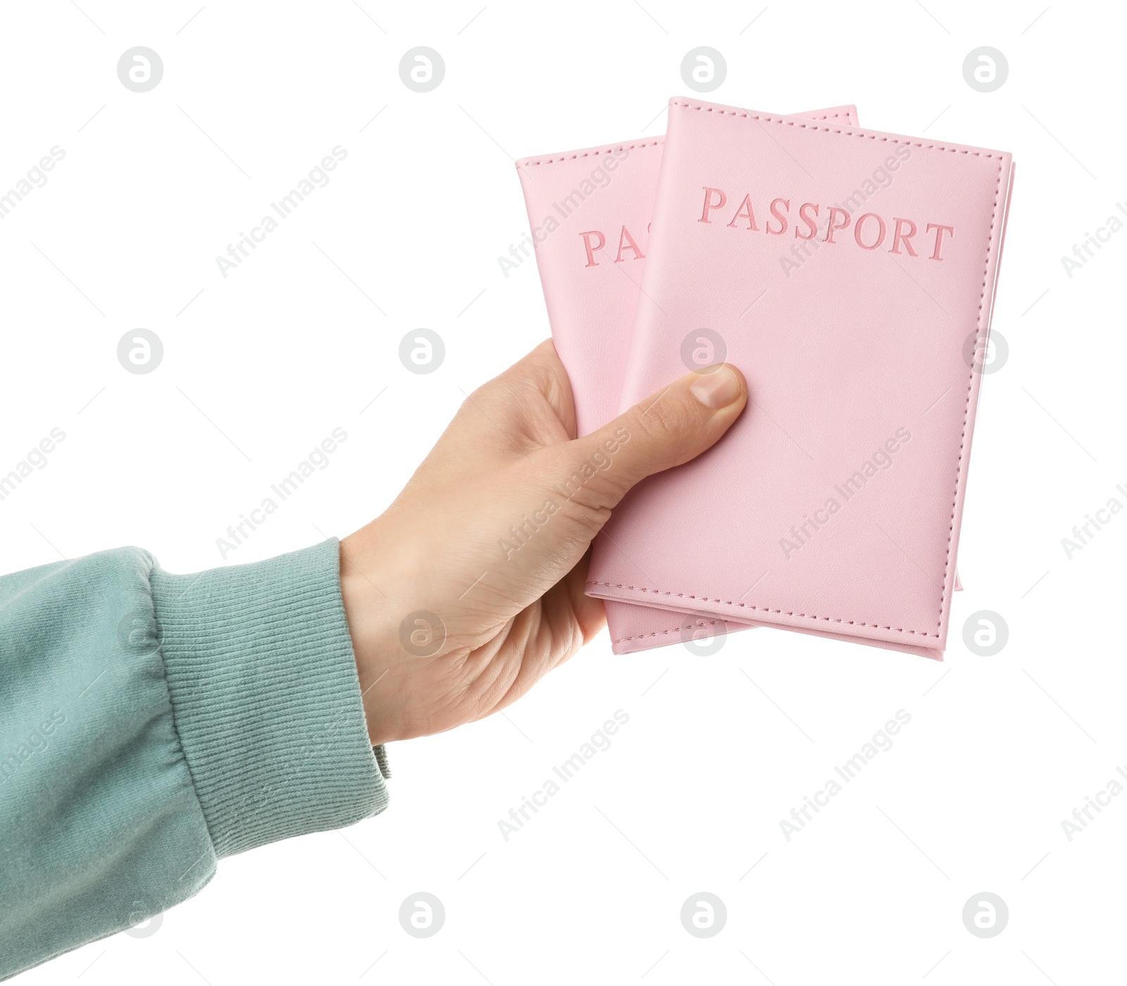 Photo of Woman holding passports in bright covers on white background, closeup