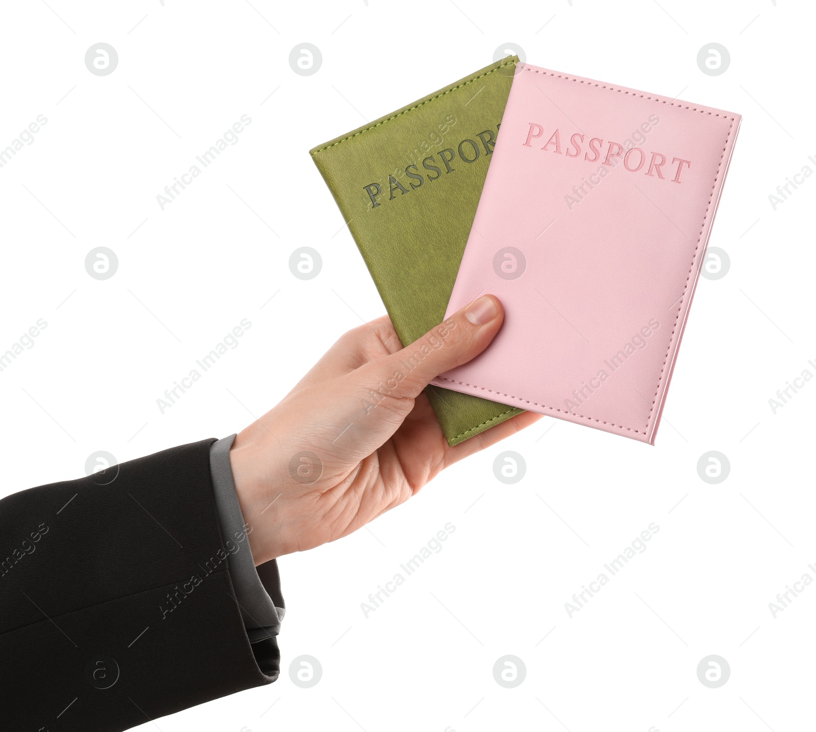 Photo of Woman holding passports in bright covers on white background, closeup