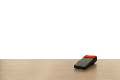 Photo of Payment terminal on wooden table against white background