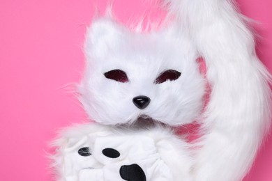 Photo of Quadrobics. Cat mask, tail and gloves on pink background, top view