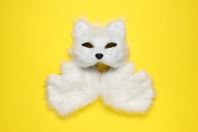 Photo of Quadrobics. Cat mask and gloves on yellow background, top view