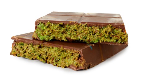 Photo of Pieces of Dubai chocolate bar with pistachio and knafeh isolated on white