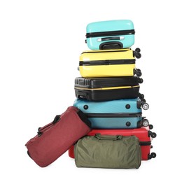 Photo of Stack of colorful suitcases and bags isolated on white