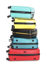 Photo of Stack of colorful suitcases isolated on white