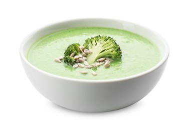 Photo of Delicious broccoli cream soup with sunflower seeds in bowl isolated on white