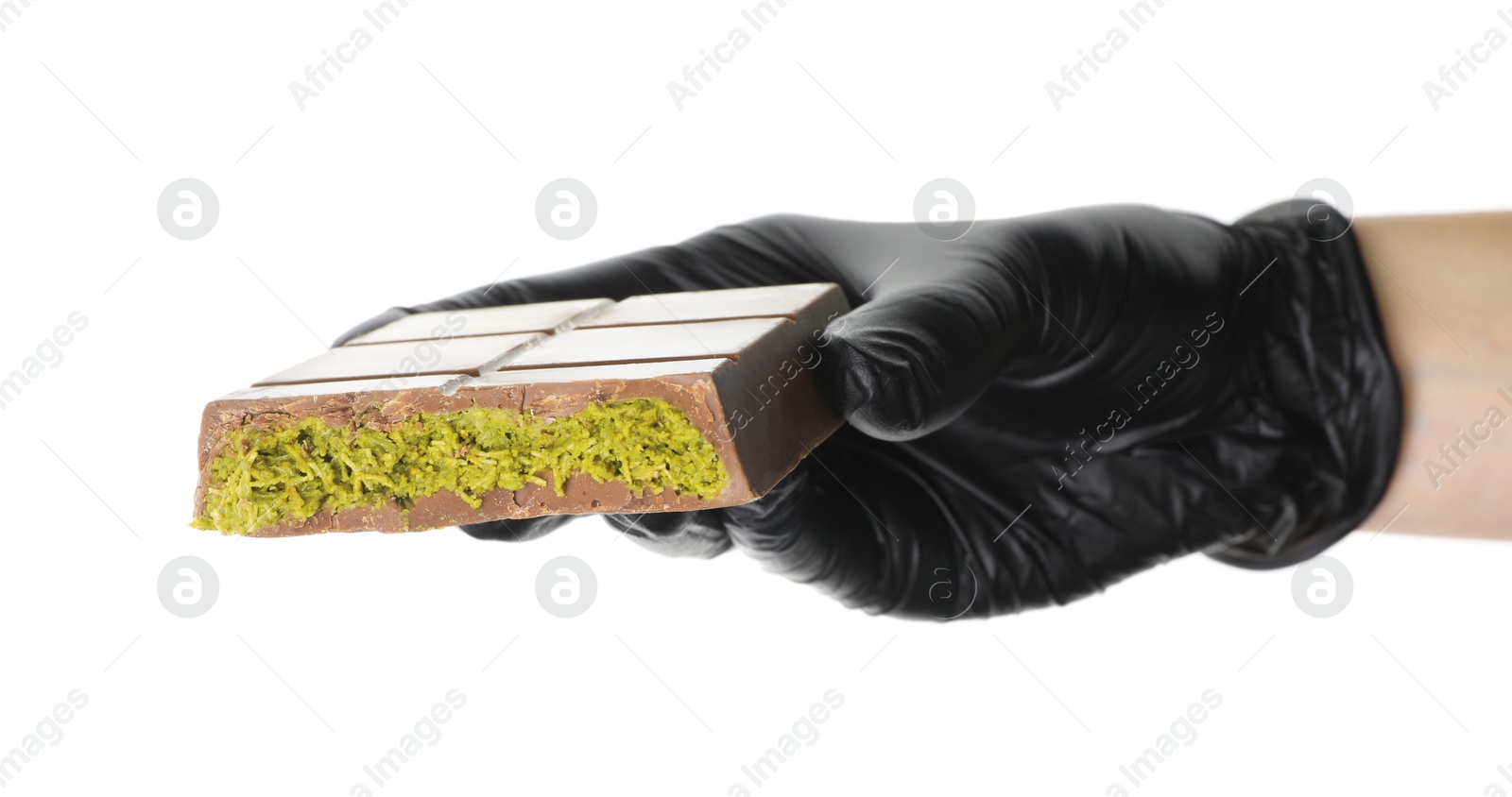 Photo of Woman holding piece of Dubai chocolate bar with pistachio and knafeh on white background, closeup