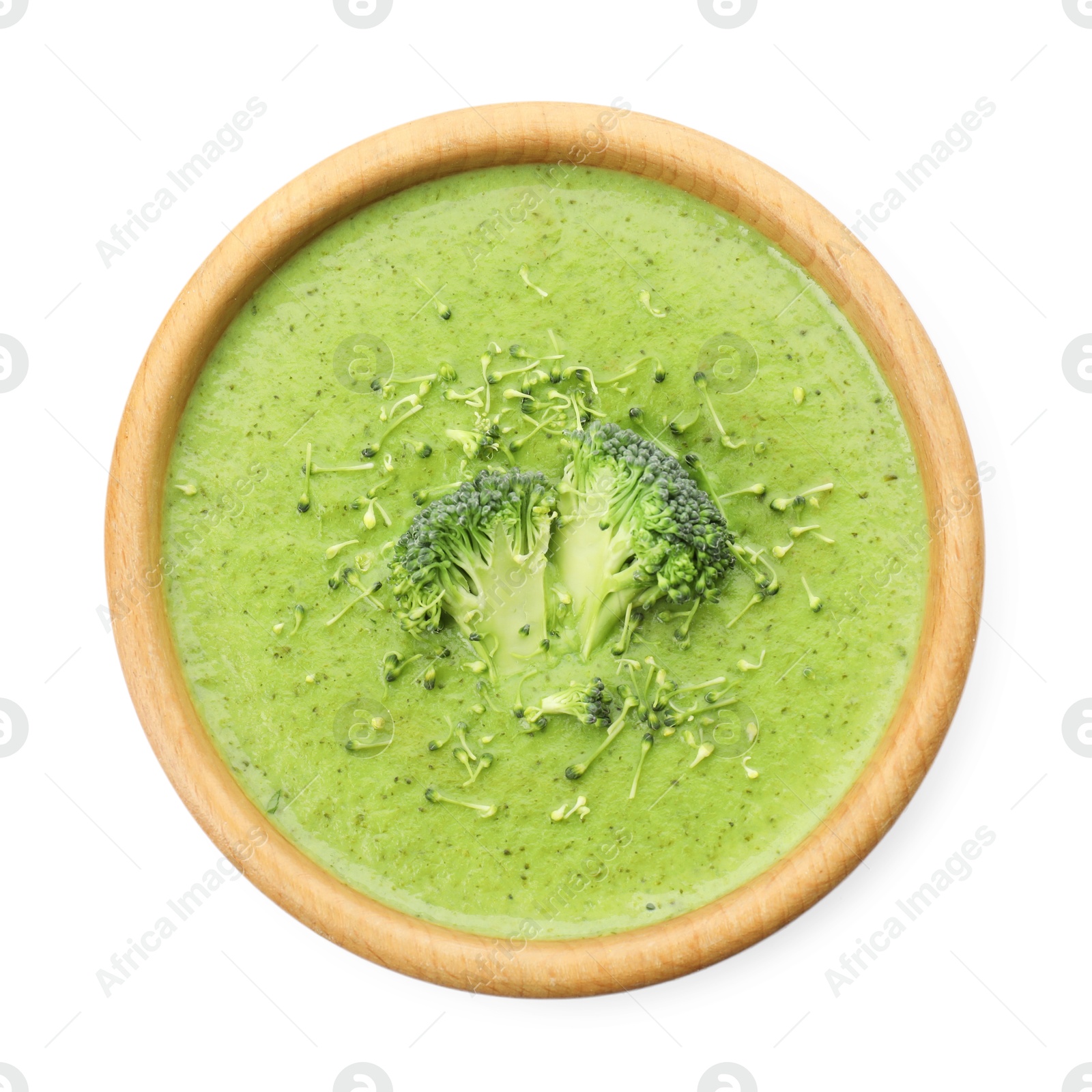 Photo of Delicious broccoli cream soup in bowl isolated on white, top view