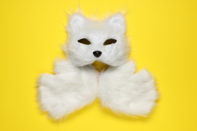 Photo of Quadrobics. Cat mask and gloves on yellow background, top view