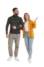 Man and woman walking on white background