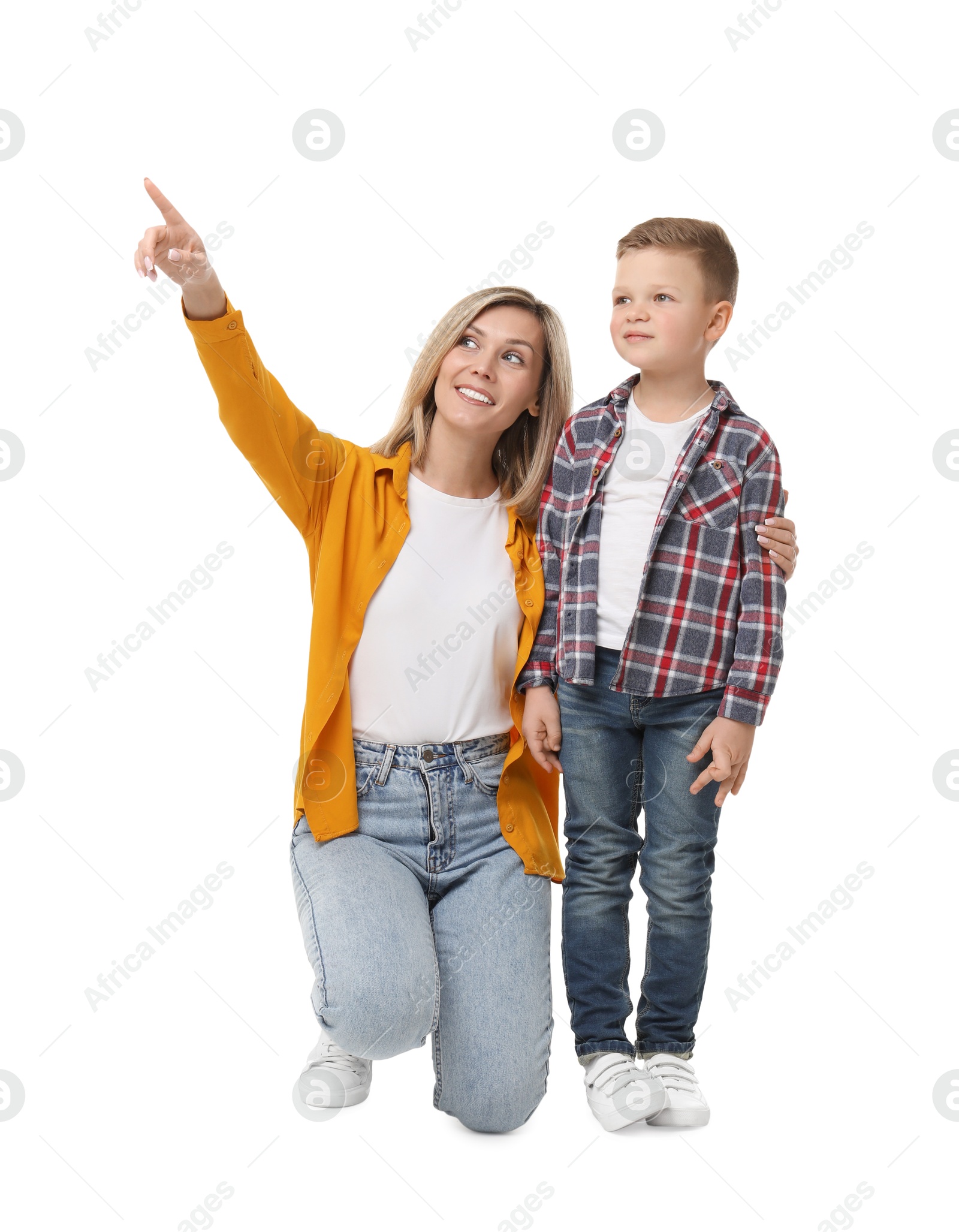 Photo of Happy mother with her cute little son looking at something on white background