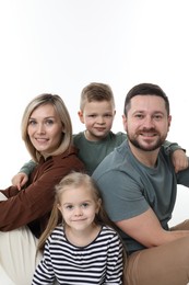 Photo of Happy parents and their children on white background