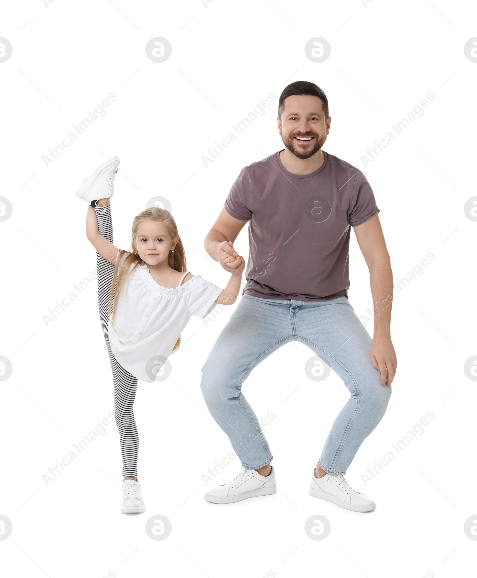 Photo of Happy father and his cute little daughter having fun on white background