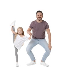 Photo of Happy father and his cute little daughter having fun on white background