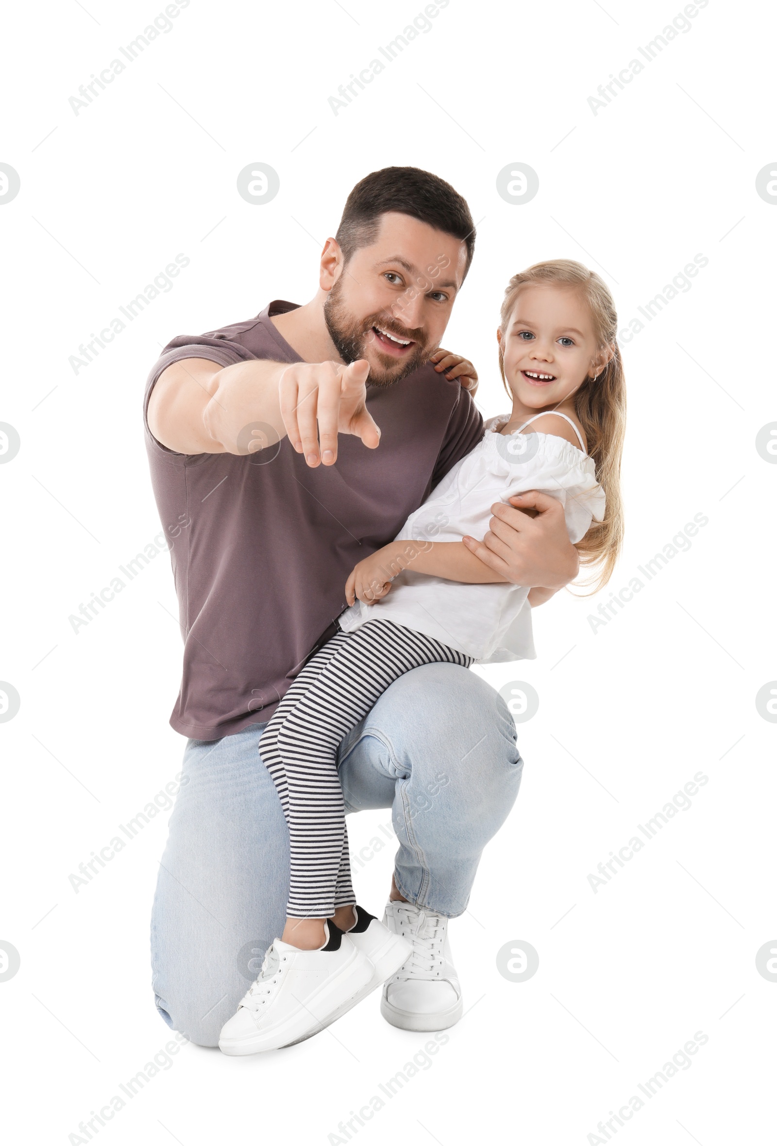 Photo of Happy father and his cute little daughter looking at camera on white background