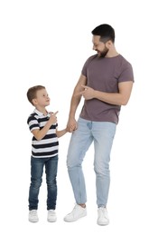 Photo of Happy father and his cute little son on white background