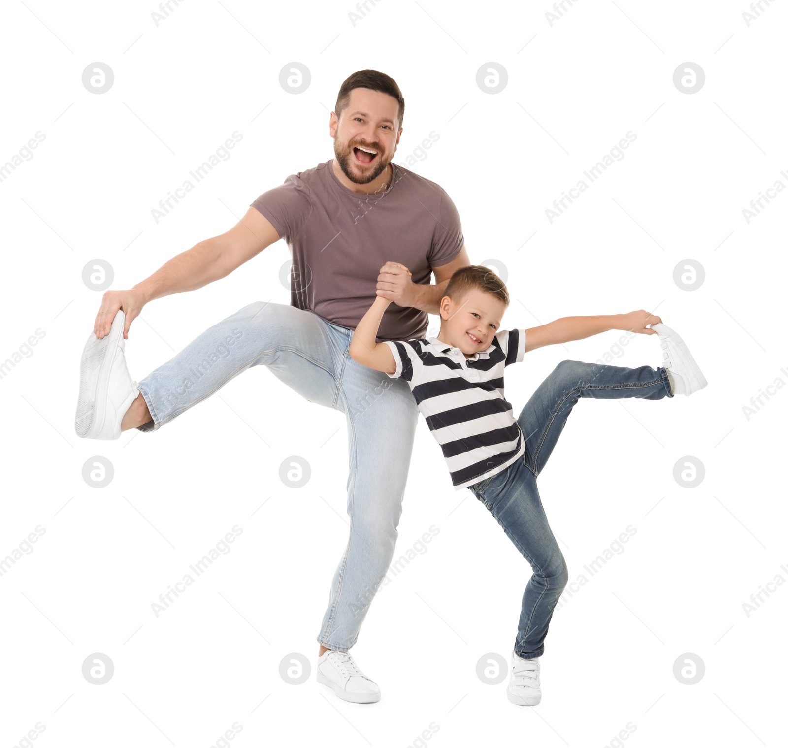 Photo of Happy father and his cute little son having fun on white background