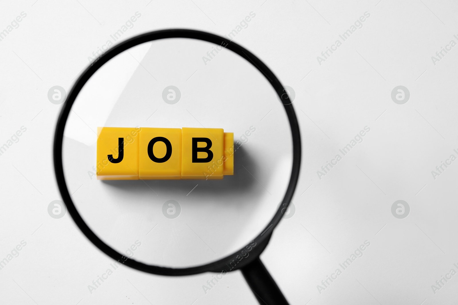 Image of Job search concept. Word made with cubes on white background, view through magnifying glass