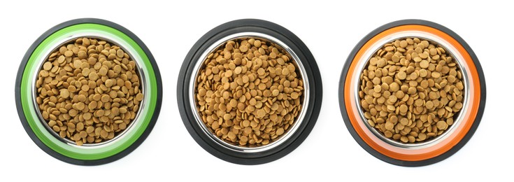 Image of Dry pet food for dogs in feeding bowls isolated on white, top view