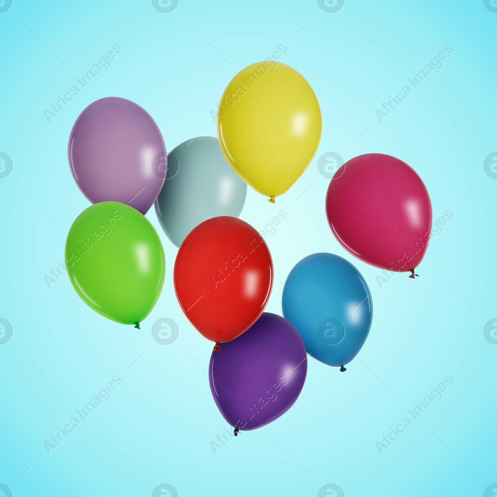 Image of Many colorful balloons in air on light blue background. Birthday or other party decoration