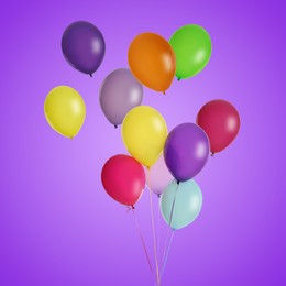 Image of Many colorful balloons in air on purple background. Birthday or other party decoration