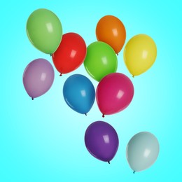 Image of Many colorful balloons in air on light blue background. Birthday or other party decoration