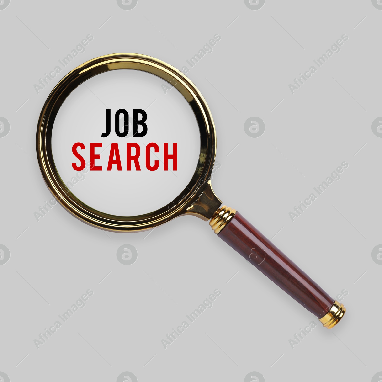 Image of Job search words on light grey background, view through magnifying glass