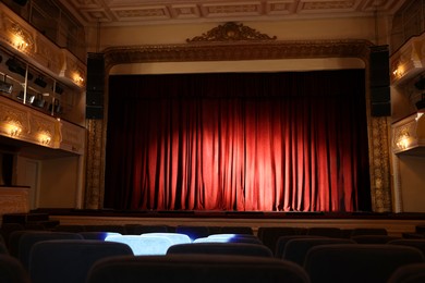 Photo of Theatre interior with stage and rows of comfortable seats