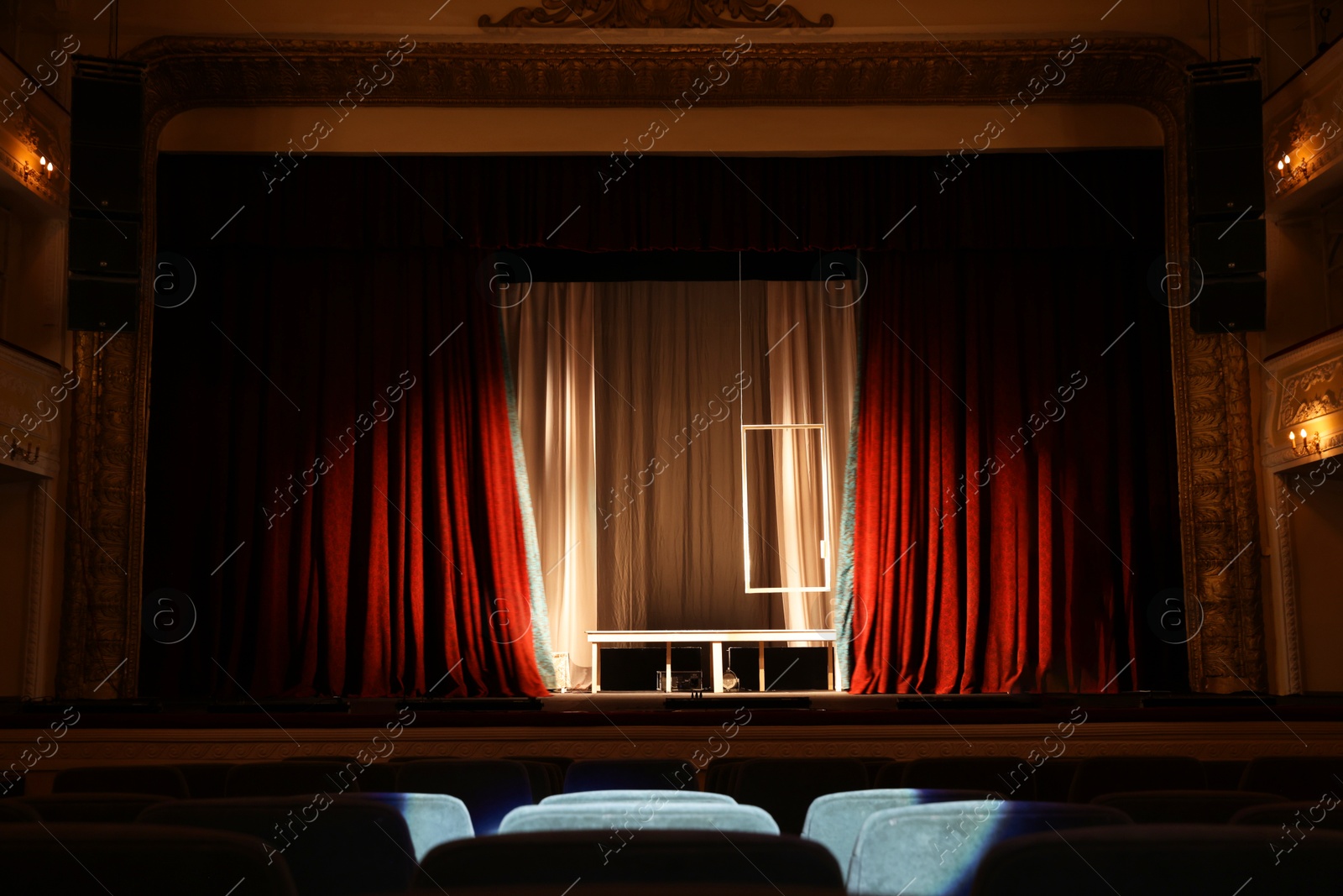 Photo of Theatre interior with stage and rows of comfortable seats