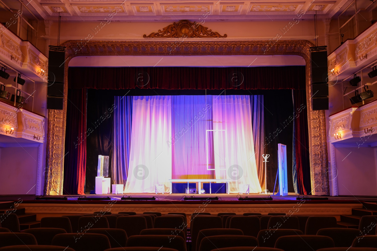 Photo of Theatre interior with stage and rows of comfortable seats