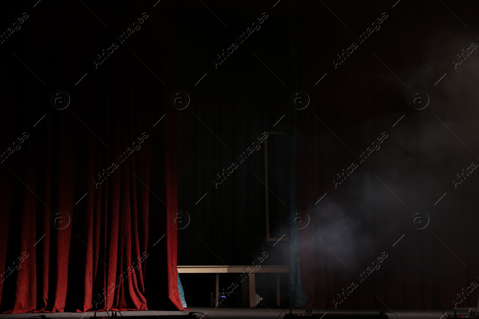 Photo of Smoke on dark stage in modern theatre