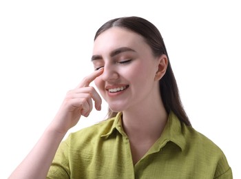 Photo of Woman touching her nose on white background