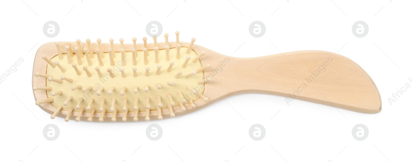 Photo of New wooden hair brush isolated on white, top view