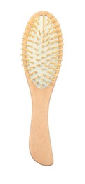 Photo of New wooden hair brush isolated on white, top view