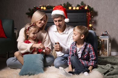 Lovely family with Christmas sparklers at home