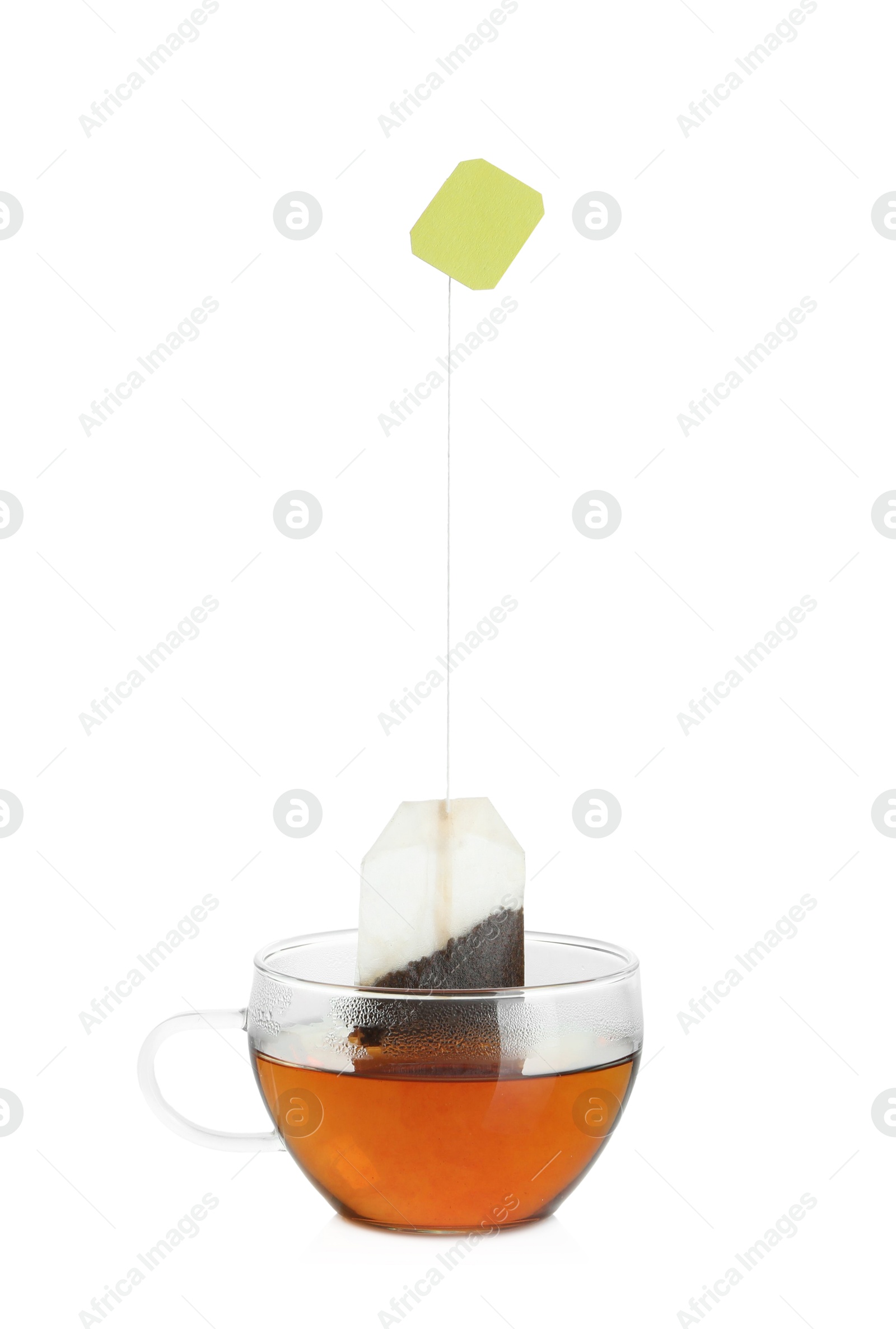 Photo of Cup with tea bag isolated on white