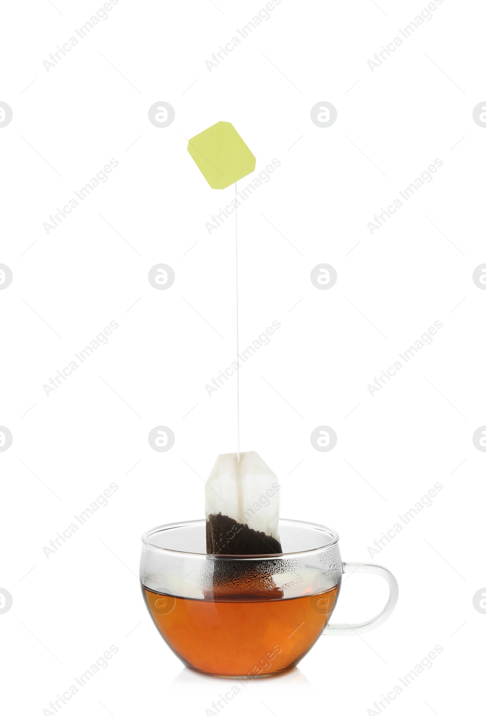 Photo of Cup with tea bag isolated on white