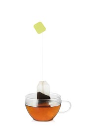 Photo of Cup with tea bag isolated on white