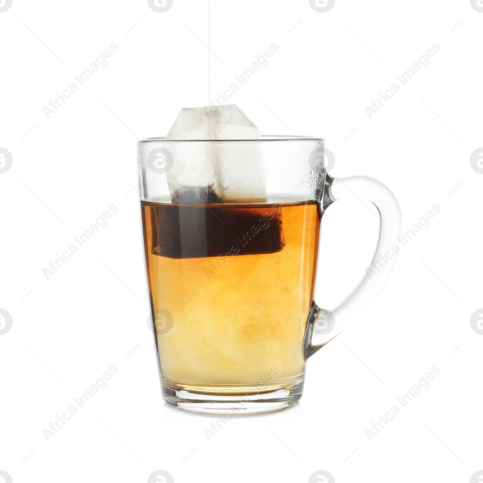 Photo of Cup with teabag isolated on white. Brewing aromatic tea