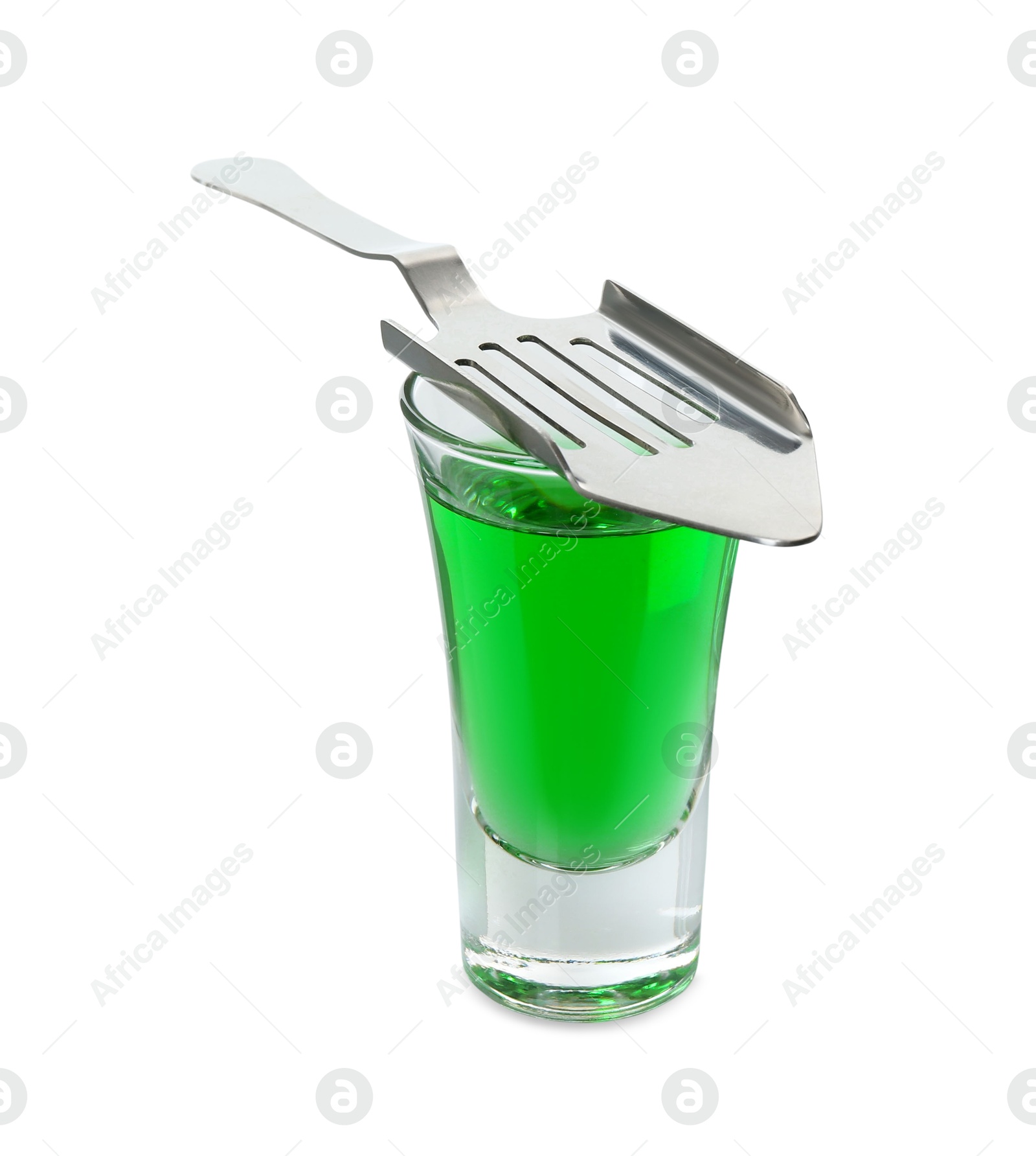 Photo of Absinthe in shot glass and slotted spoon isolated on white