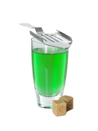 Photo of Absinthe in shot glass, brown sugar cubes and slotted spoon isolated on white