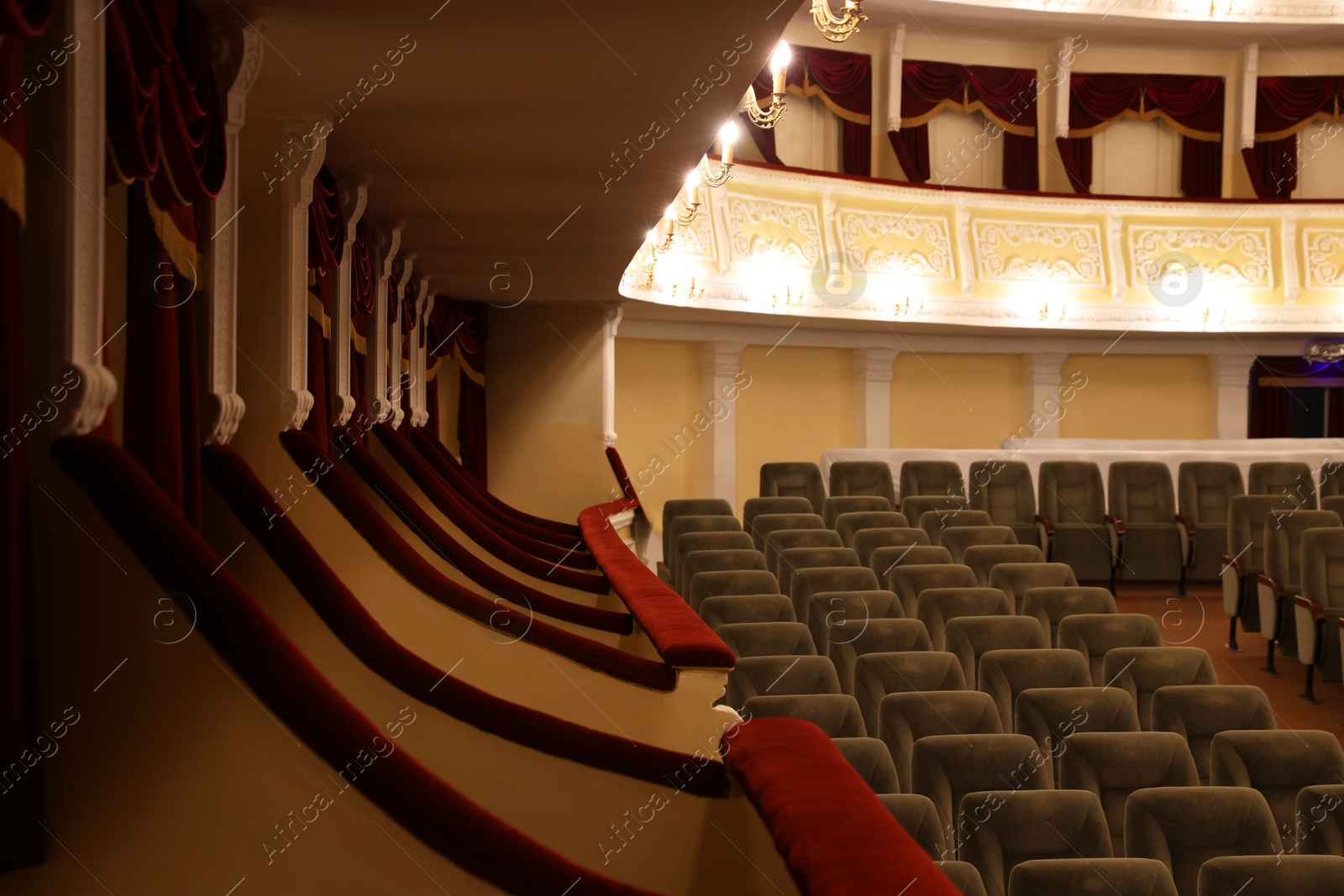 Photo of Rows of gray comfortable seats in theatre