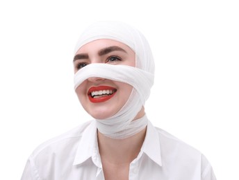 Photo of Woman with nose wrapped in medical bandage after plastic surgery operation on white background