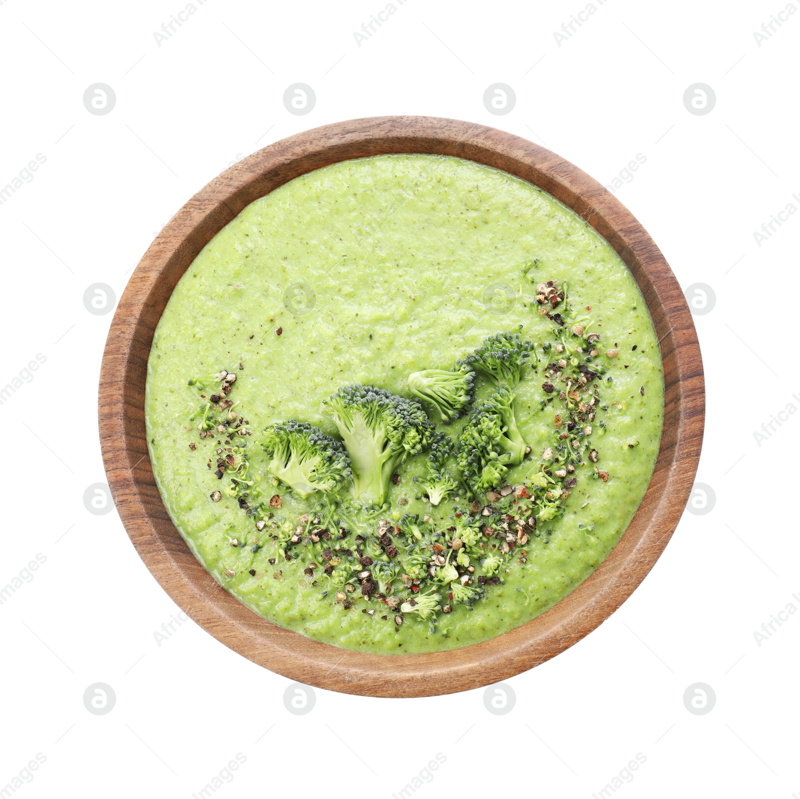 Photo of Delicious broccoli cream soup in bowl isolated on white, top view